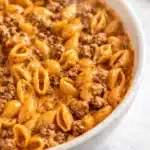 Creamy homemade hamburger helper with pasta shells and ground beef in cheese sauce