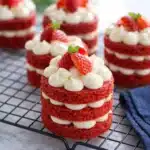 Mini red velvet cakes with cream cheese frosting and strawberries