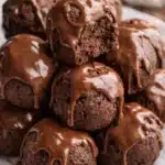 No bake cottage cheese protein bites with glossy chocolate drizzle