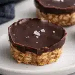 No bake peanut butter oat cups topped with dark chocolate and sea salt