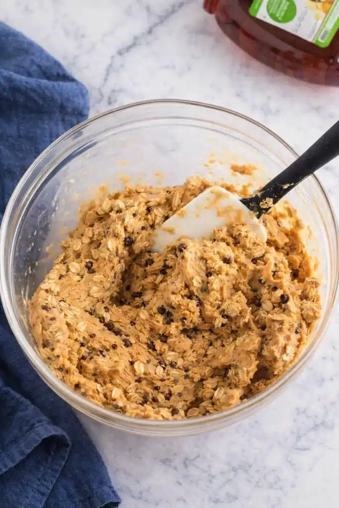 No Bake Protein Balls – Simple and Powerful Snack 13 Glass bowl of mixed peanut butter oat dough for no bake protein balls