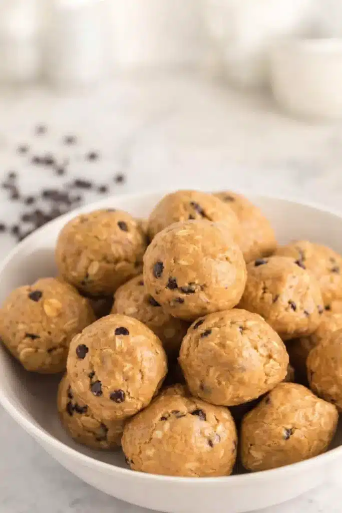 No Bake Protein Balls – Simple and Powerful Snack 15 Bowl of no bake protein balls with oats and chocolate chips
