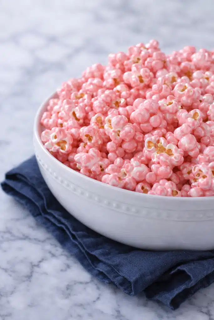 Pink Popcorn: Valentine’s Day Colored Popcorn Treat 6 Pink popcorn in a white bowl on soft linen background