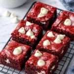 Delicious red velvet cake mix brownies topped with white chocolate chips