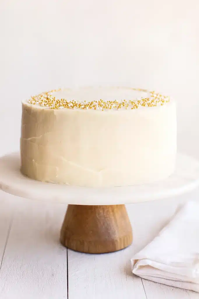 Red Velvet Cake | Amazing, Soft & Vibrant Dessert 6 Whole red velvet cake with cream cheese frosting and gold sprinkles