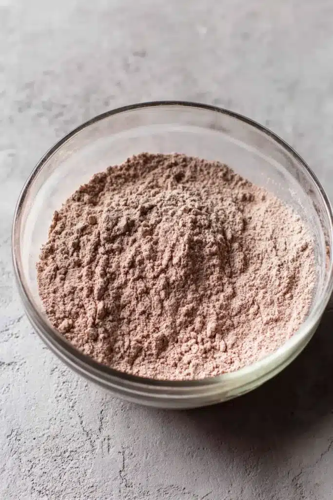 Red Velvet Cupcake Cookies | Irresistibly Soft & Creamy 12 Red velvet cupcake cookie dry ingredients mixed in a glass bowl