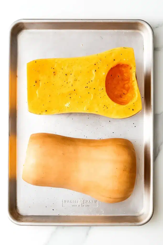 Roasted Butternut Squash Soup | Simple, Cozy & Delicious 11 Halved butternut squash on baking tray ready for roasting