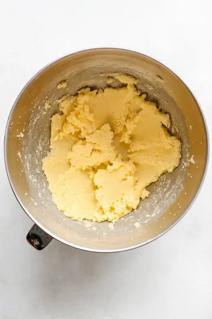 Slice and Bake Heart Cookies | Easy Valentine’s Recipe 11 Soft cookie dough for slice and bake heart cookies in a metal bowl on white-gray surface