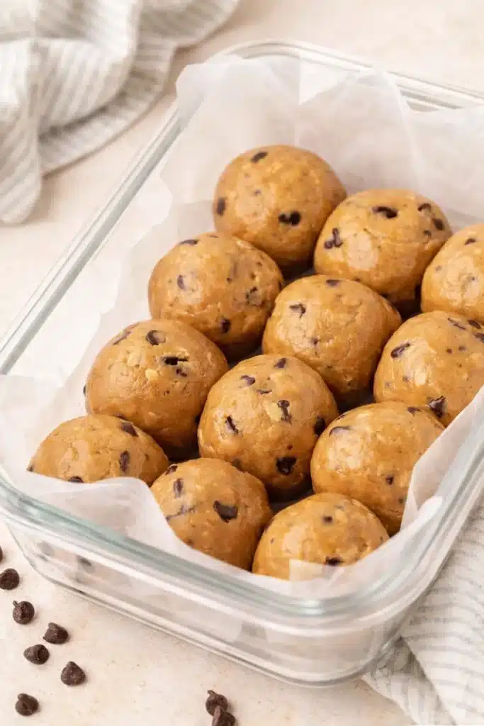 No Bake Protein Balls – Simple and Powerful Snack 18 Glass container with no bake peanut butter protein balls and chocolate chips