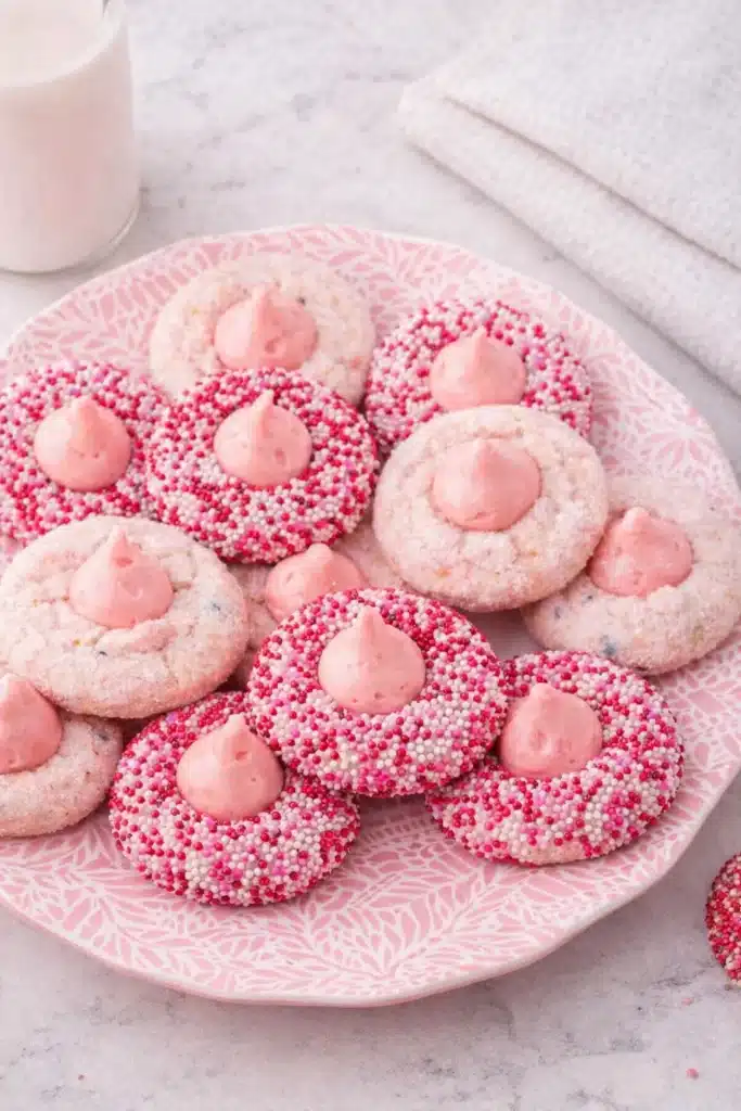 Strawberry Kiss Cookies on pink plate with white napkin and milk
