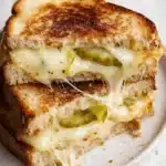 Crispy dill pickle grilled cheese sandwich with melted havarti on toasted sourdough