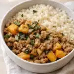 Healthy roasted butternut squash with ground turkey and couscous in a rustic bowl