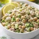 Healthy tuna garbanzo bean salad with lemon and dill in white bowl