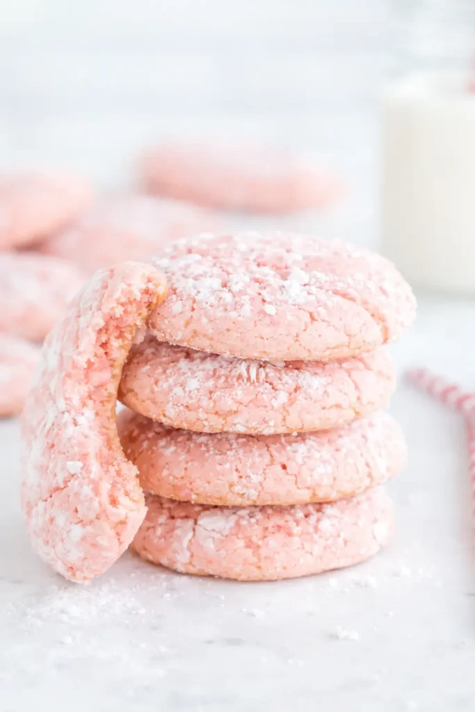 Strawberry Crinkle Cookies | Quick, Amazing Dessert Recipe 5 Stack of strawberry crinkle cookies with powdered sugar on marble surface