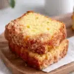 Close-up of vanilla eggnog bread with crumb topping on wooden board