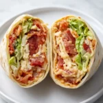 Zesty BLT wraps with bacon, lettuce, tomato, and chipotle mayo on white plate
