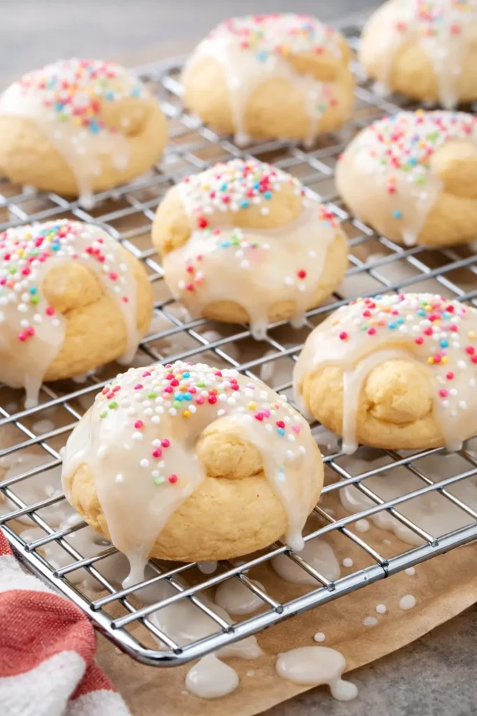 Italian Easter Cookies : Easy Uncinetti Recipe 6 Italian Easter Cookies Uncinetti with glossy lemon glaze and colorful sprinkles