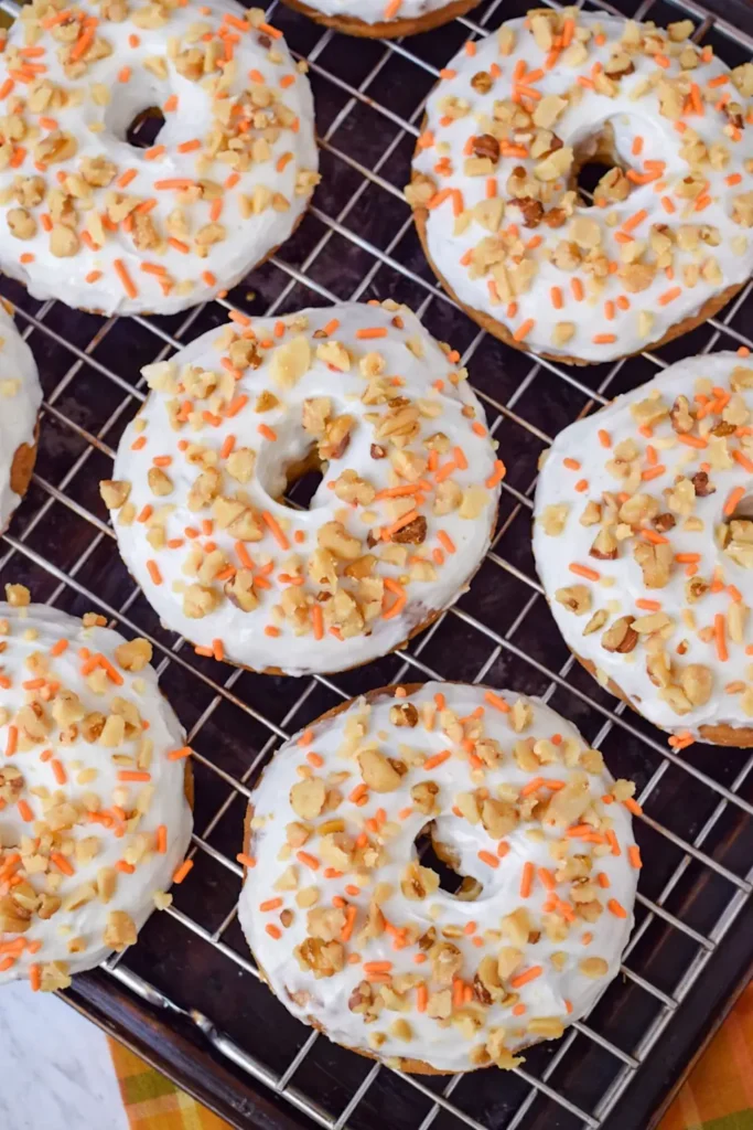 Carrot Cake Donuts with cream cheese frosting on cooling rack