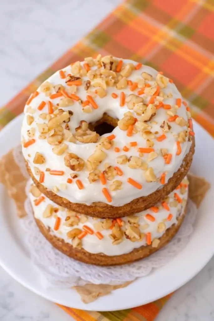Stacked Carrot Cake Donuts with cream cheese frosting and walnuts