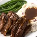 Tender Crock Pot chuck roast with mashed potatoes and green beans