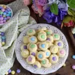 Easter Bunny Button Cookies with pastel candy centers on white plate