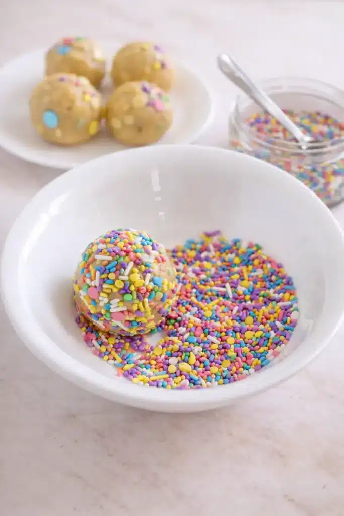 Easter cookie dough balls rolled in colorful pastel sprinkles