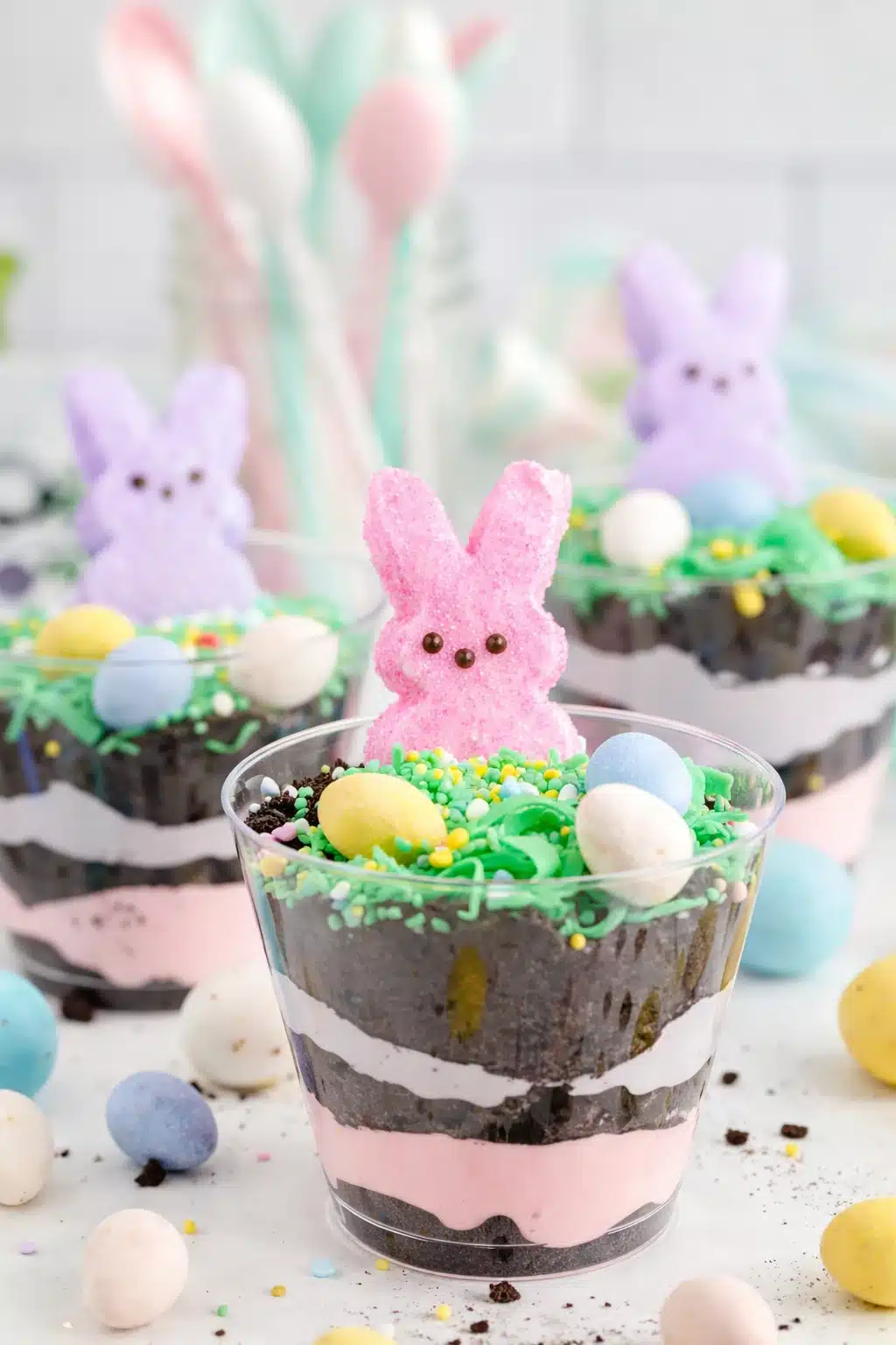 Easter Dirt Cups with Peeps and candy eggs layered in clear cups