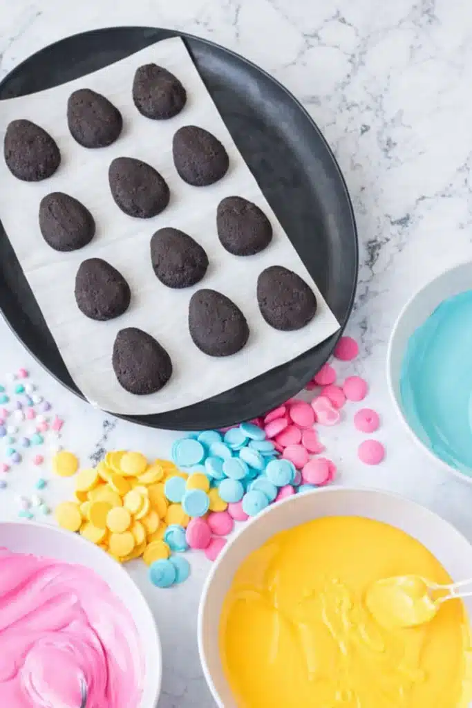 Dark Oreo truffle eggs with colorful melted candy coatings for Easter Egg Oreo Balls