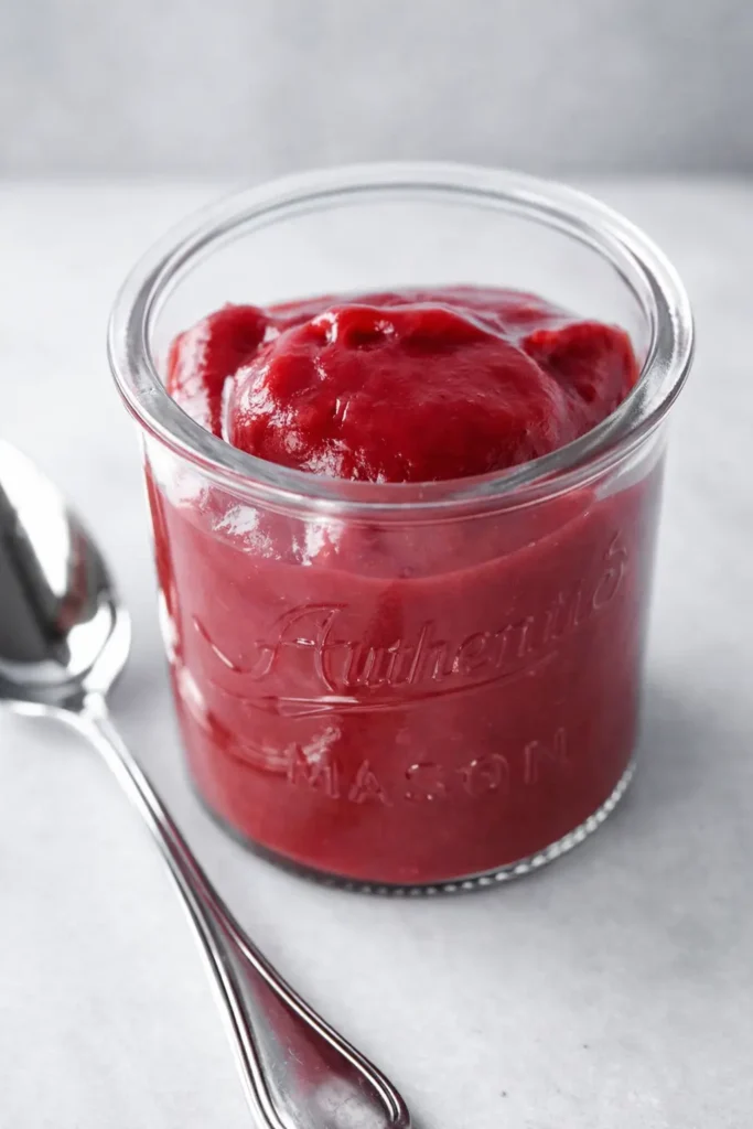 Easy Rhubarb Butter in glass jar with smooth glossy texture