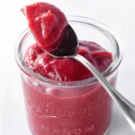 Easy Rhubarb Butter in a glass jar with spoon