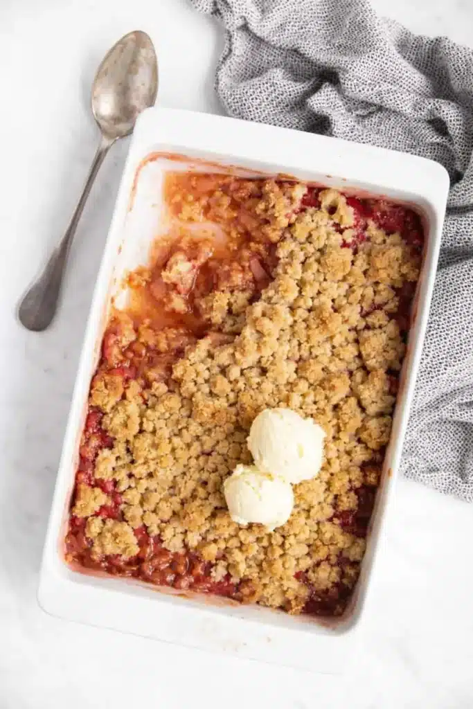Easy Rhubarb Crisp – Amazing Homemade Dessert 5 Easy Rhubarb Crisp in baking dish with vanilla ice cream