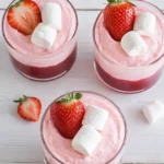 Fluffy strawberry mousse with fresh strawberries and marshmallows in glass cups