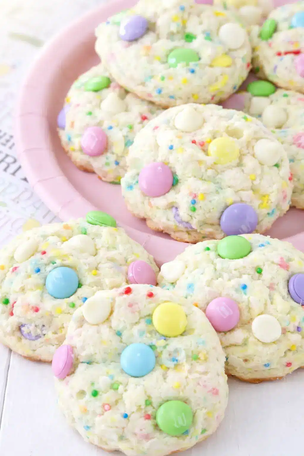 Soft Funfetti Cake Cookies for Easter with pastel candies and white chocolate chips on spring plate