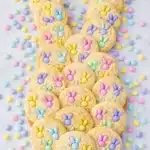 Pastel M&M Bunny Cookies arranged in bunny shape on linen background