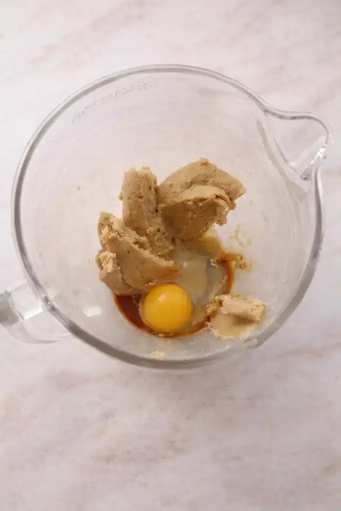 Egg and vanilla added to cookie dough for Easter cookies