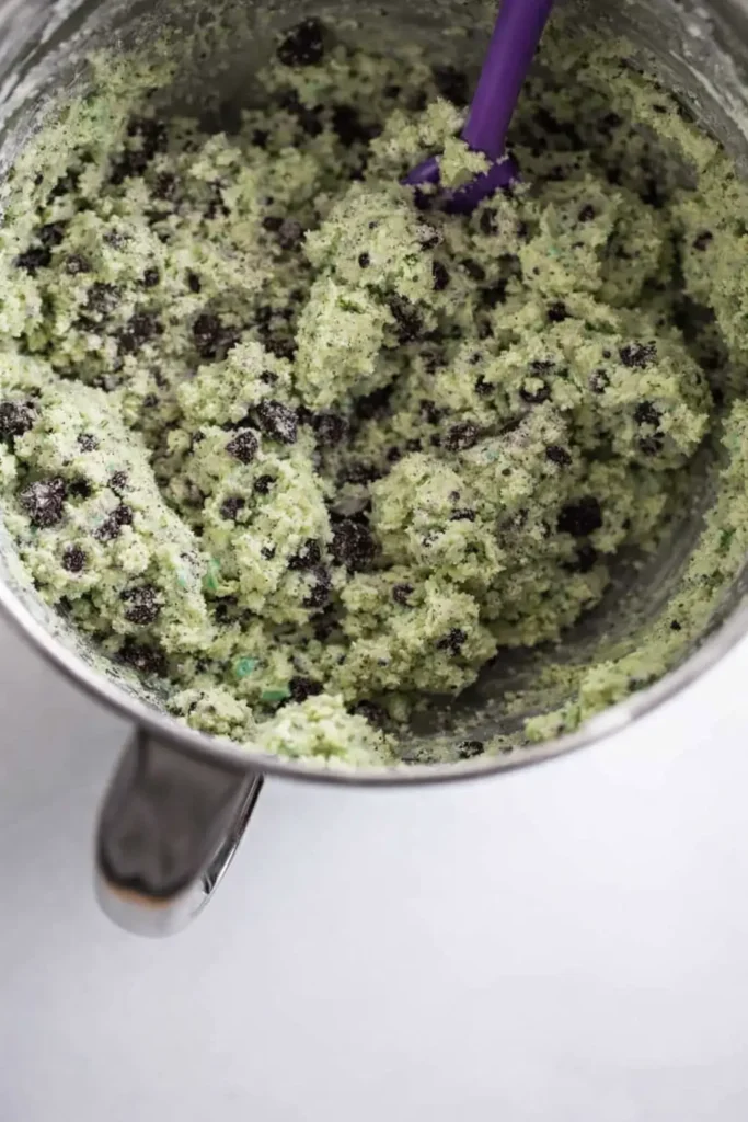 Soft Mint Oreo Shamrock Shake Cookies for St. Patrick’s Day 5 Oreo Shamrock Shake Cookies mint green dough with crushed Oreos in mixing bowl
