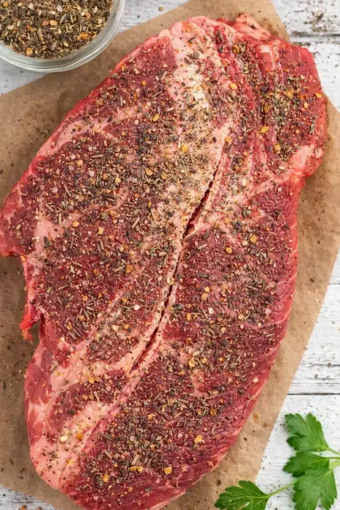 Seasoned chuck roast ready for Crock Pot slow cooking