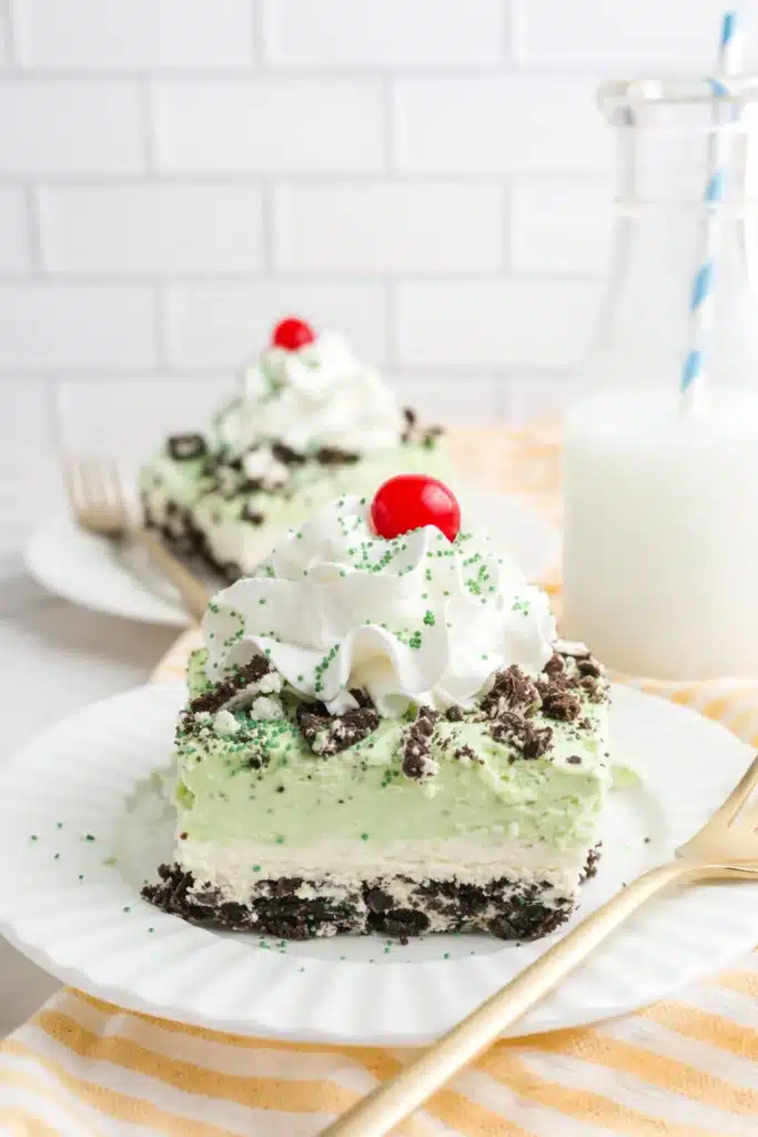 Shamrock Lasagna slice with mint layers, whipped cream, and cherry