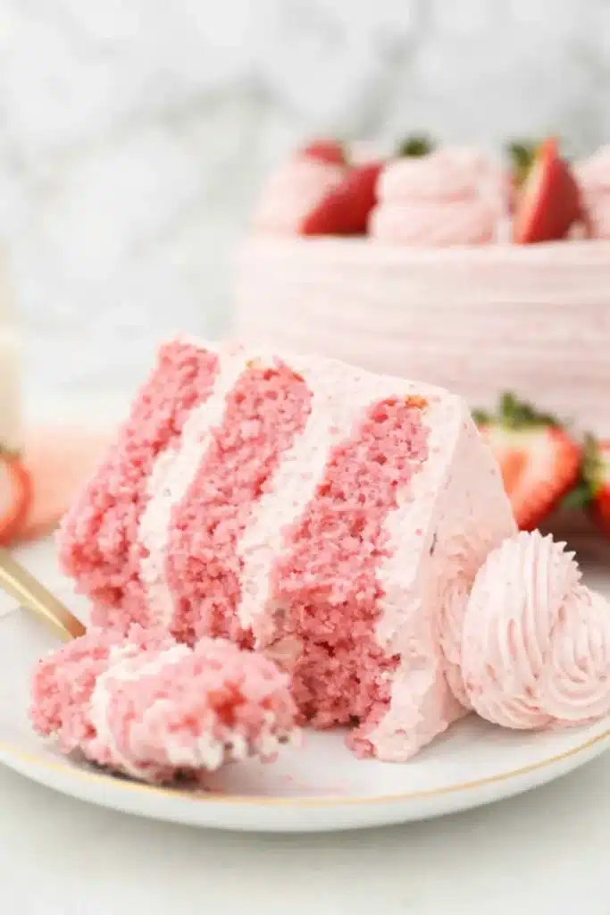 Strawberry Cake with Strawberry Frosting | Sweet & Simple 6 Slice of strawberry cake with strawberry frosting on plate with fork
