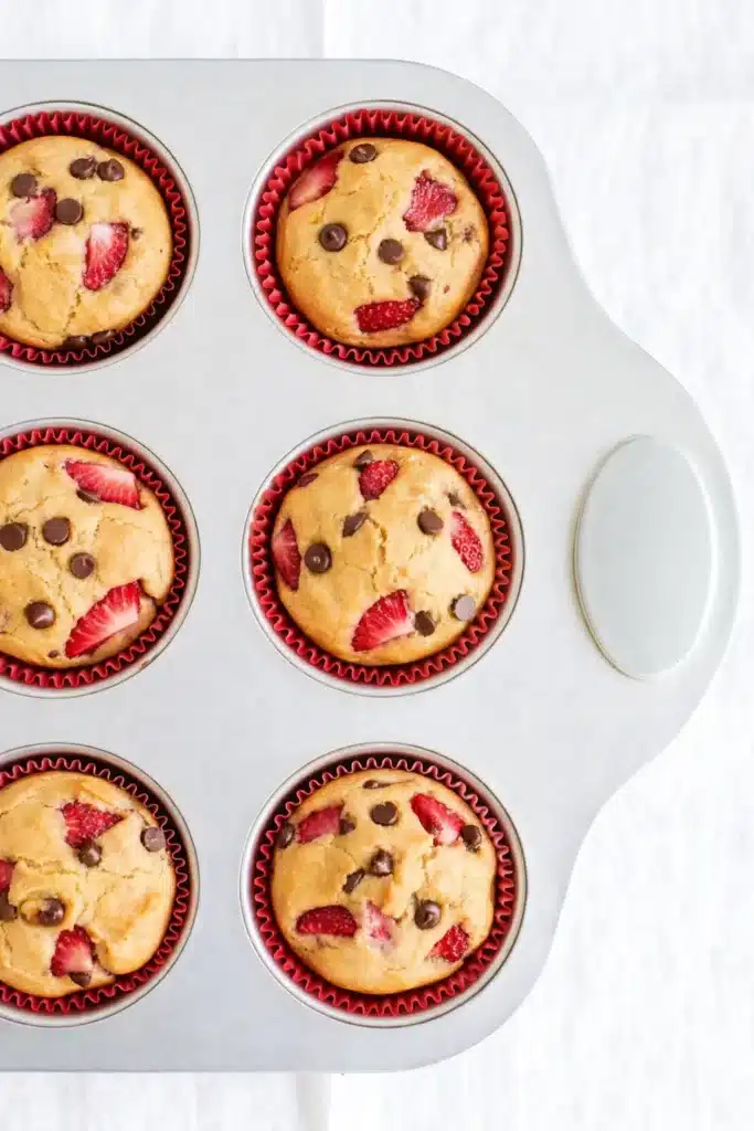 Strawberry Protein Muffins Quick Powerful Breakfast Boost 5 Strawberry Protein Muffins baked in muffin tin overhead view