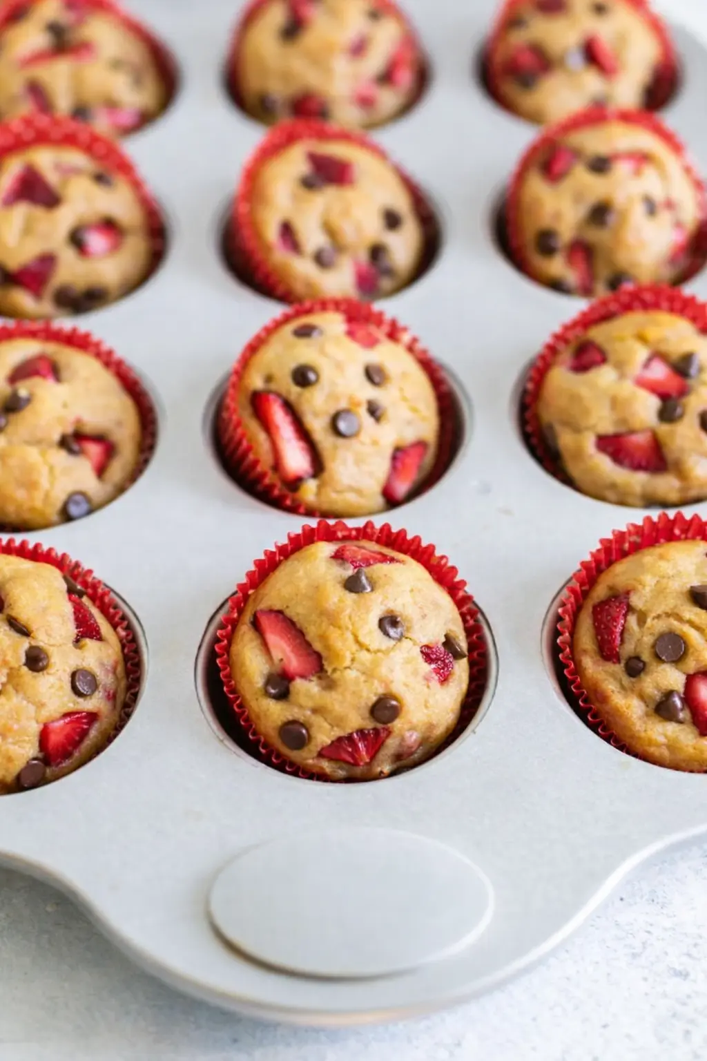 home 9 Strawberry protein muffins with chocolate chips in muffin tin