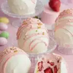 Strawberry shortcake Easter egg bombs with white chocolate shell and strawberry cream filling
