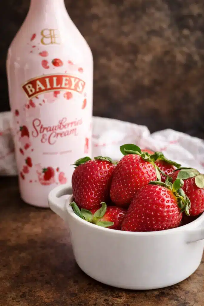 Fresh strawberries and strawberry cream liqueur for Strawberry Shortcake Martini