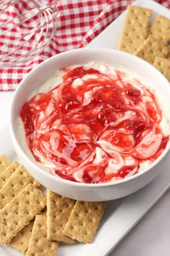 Easy Strawberry Cheesecake Dip Recipe 5 Strawberry Cheesecake Dip with strawberry swirl and graham crackers