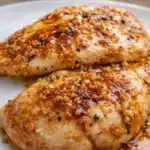 Brown sugar garlic chicken with glossy caramelized glaze and minced garlic