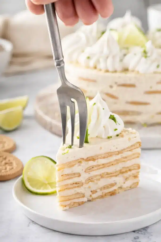 Carlota de Limón slice with Maria cookie layers and creamy lime filling