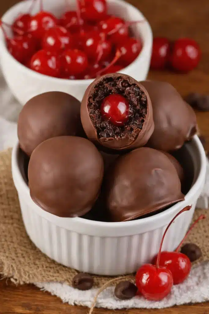 Chocolate Covered Cherry Brownie Bombs with cherry center in ramekin bowl