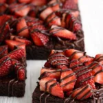 Chocolate-covered strawberry brownies with fresh strawberries and chocolate drizzle