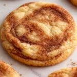 Cinnamon roll sugar cookie with soft center and cinnamon swirl topping