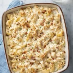 Classic crack chicken casserole with creamy cheese, bacon, and pasta in a baked dish